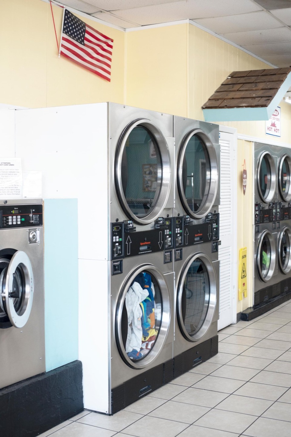 Stacked dryers under the American flag