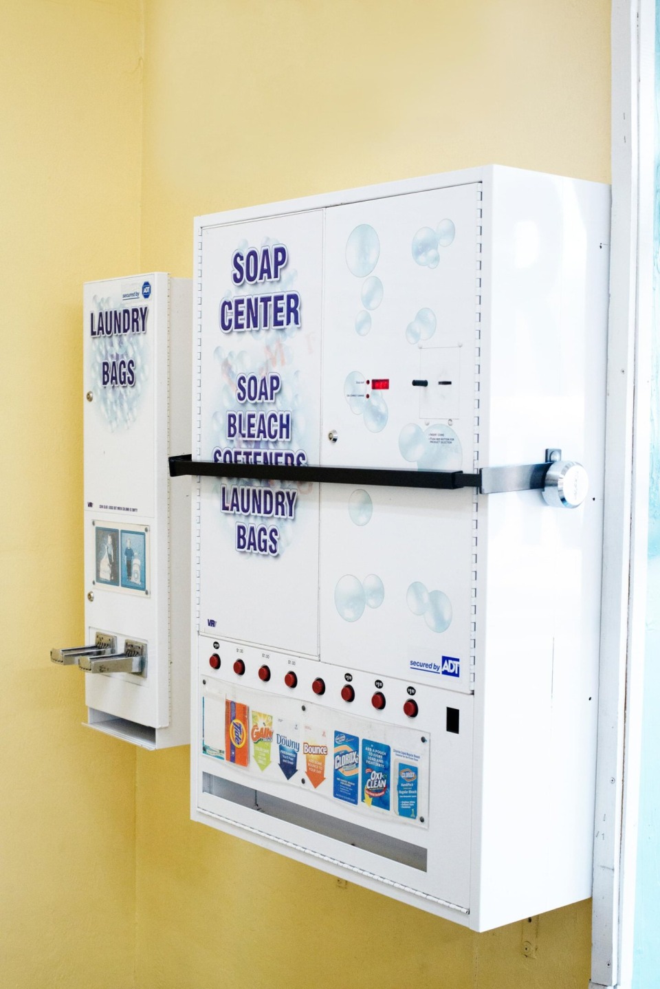 Soap center dispenser with detergent, bleach and laundry bags