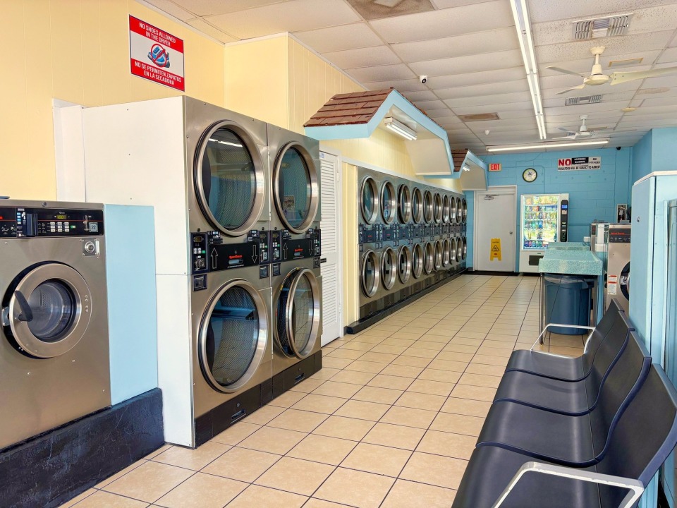 Stacked dryers and customer seating area