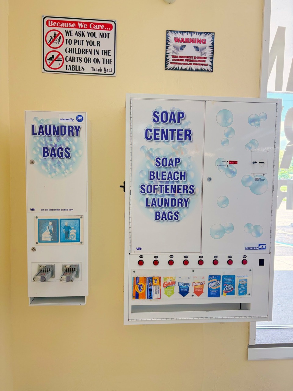 Soap center vending machine with detergent, bleach and laundry bags